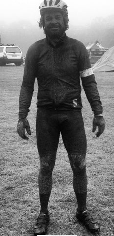 Wet and muddy mountain biker 